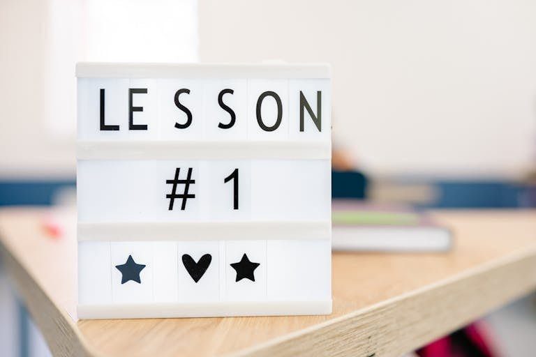 Lightbox sign displaying 'Lesson #1' in a classroom setting, symbolizing education and new beginnings.